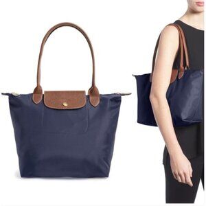 Longchamp Le Pliage Foldable Tote Bag in Navy Blue.